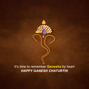 Ganesh Chaturthi greeting with a golden Ganesha symbol and text