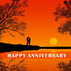 Silhouette of a couple kissing at sunset with 'Happy Anniversary' text