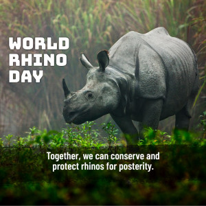A majestic rhinoceros in a grassy field with text promoting World Rhino Day.