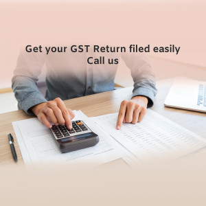 Person calculating GST return with calculator and laptop
