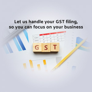 GST filing with wooden blocks and financial charts