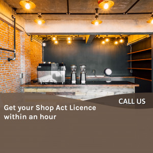 Interior of a warmly lit cafe with a coffee machine and a promotional banner for Shop Act Licence.