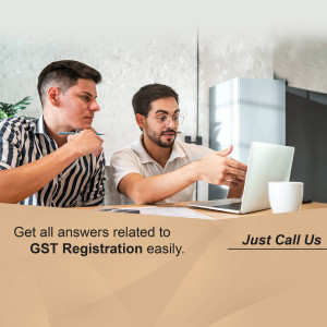 Two professionals discussing GST registration on a laptop