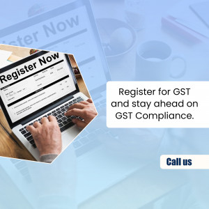 Laptop displaying GST registration form with a person typing and a call to action.