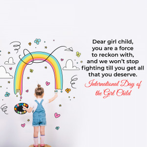 A young girl painting a rainbow on a white wall with the message 'Dear girl child, you are a force'.