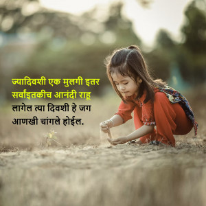 A young girl is kneeling and playing with dirt in a field.