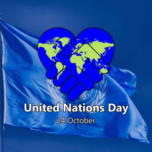 Image depicting a handshake forming a heart with a world map, representing United Nations Day.