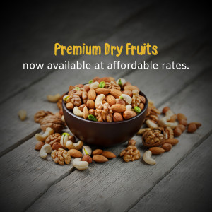 Bowl of assorted premium dry fruits and nuts on a wooden surface