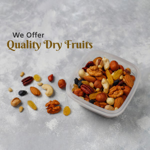 A clear plastic container filled with a colorful mix of dry fruits and nuts, with some scattered around it.