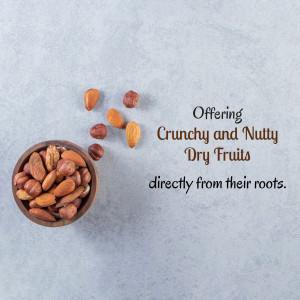 A bowl of assorted dry fruits including almonds and hazelnuts with scattered nuts around it.