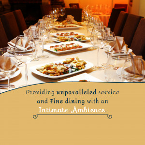 A beautifully set dining table with multiple courses of food, glasses, and napkins.