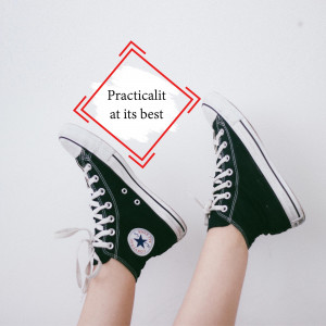 Close-up of black Converse high-top sneakers with red diamond graphic