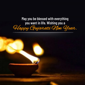 Gujarati New Year greeting with a lit diya