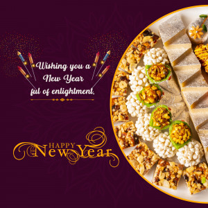 Assorted Indian sweets arranged on a silver platter with New Year wishes.
