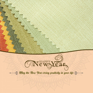 Assorted fabric swatches with a New Year greeting