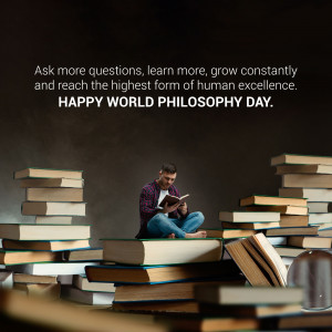 A person reading a book surrounded by stacks of books, celebrating World Philosophy Day.