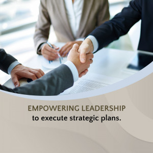 Business professionals shaking hands over a document, symbolizing a successful agreement.