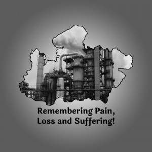 Black and white image of an industrial complex with smoke stacks, torn paper effect, and text 'Remembering Pain, Loss and Suffering!'