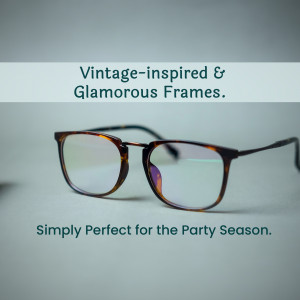 Close-up of brown tortoise shell framed eyeglasses on a white surface.