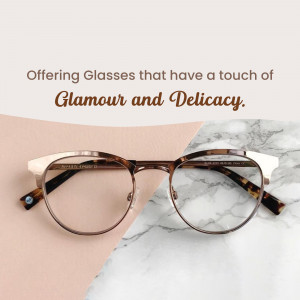 Close-up of stylish eyeglasses on a textured surface.