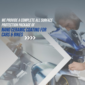 A blue motorcycle undergoing nano ceramic coating application in a workshop.