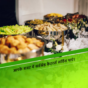 A close-up of a lavish Indian food buffet with various dishes in silver chafing dishes.