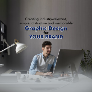 Man working on a computer with graphic design text overlay