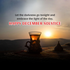A glass of tea with a sunset background and the text 'Happy December Solstice'