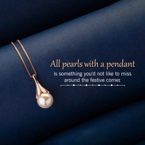 Close-up of a gold pendant with a single pearl