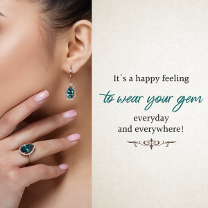 Close-up of a woman wearing turquoise gemstone earrings and a ring