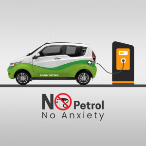 White and green electric car charging at a station with 'No Petrol, No Anxiety' text.