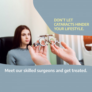 Hands holding cataract surgery equipment with a patient in the background.