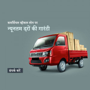 Red Mahindra commercial vehicle with boxes, advertising loan offer