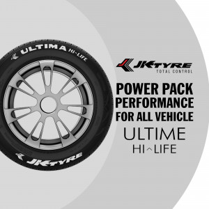Close-up of a JK Tyre Ultima Hi-Life tire with branding and promotional text.