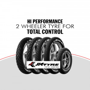 Stack of JK Tyre 2-wheeler tyres with branding