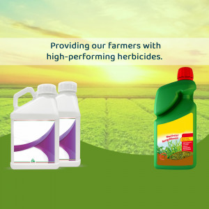 Bottles of herbicides in a field with a sunset background