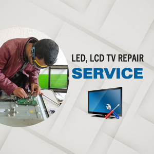Technician repairing a TV with tools