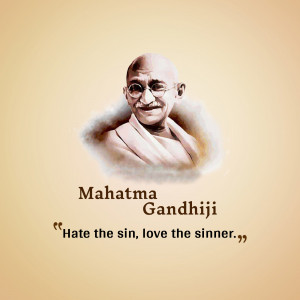 Portrait of Mahatma Gandhi with a famous quote about hate and love.