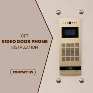 Gold video door phone with keypad and screen mounted on a wall