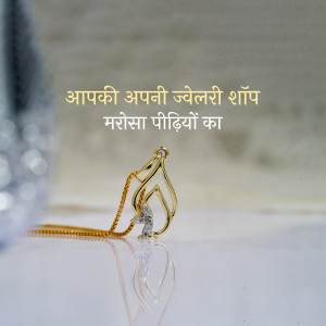 Close-up of a delicate gold pendant with a small diamond, resting on a reflective surface.