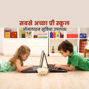 Two children using laptops at preschool