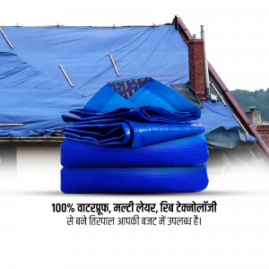 Blue waterproof tarp covering a roof with a folded tarp on top
