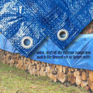 Close-up of a blue tarp covering a stack of firewood with metal grommets.