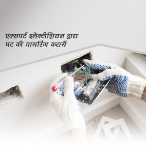 Electrician repairing electrical wiring in a wall