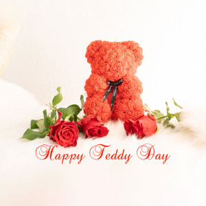 Red rose bear with roses and 'Happy Teddy Day' text