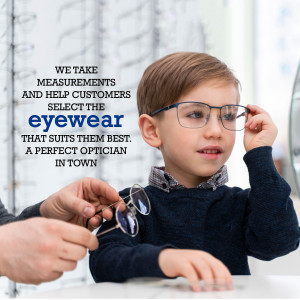 A young boy getting his glasses adjusted by an optician.
