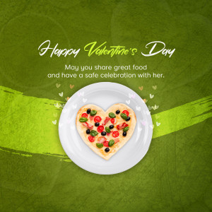 Heart-shaped pizza on a white plate with Valentine's Day greeting.