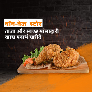 Fried chicken pieces served on a wooden board with fresh vegetables.