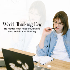 Woman thoughtfully writing in a notebook with a laptop, celebrating World Thinking Day.