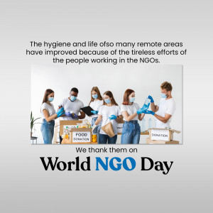 Volunteers wearing masks and gloves packing food donations for remote areas on World NGO Day.